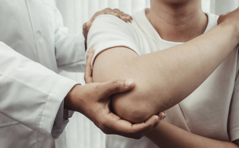 Chiropractor assessing patients pain